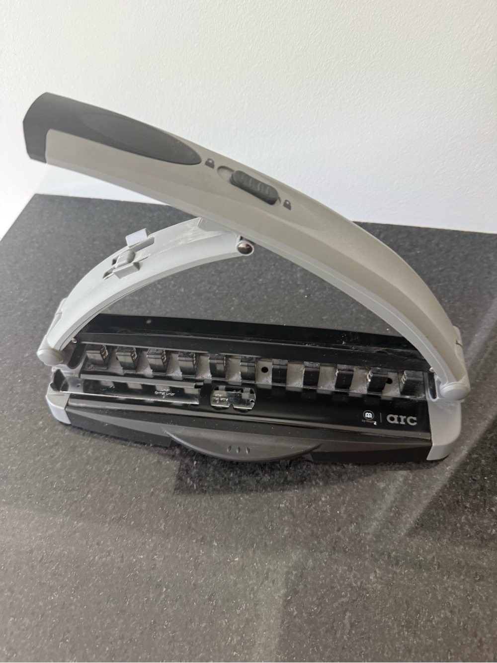 Staples Arc desktop paper punch in Gray and Black